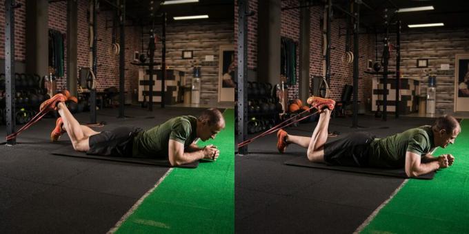 Circuit d'entraînement dans le gymnase: flexion des pieds dans le simulateur ou extenseurs