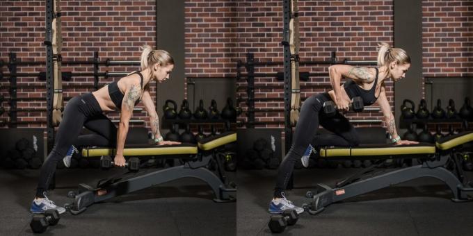 Le programme de formation pour les jeunes femmes dans la salle de gym: poussée haltère à sa taille dans la pente