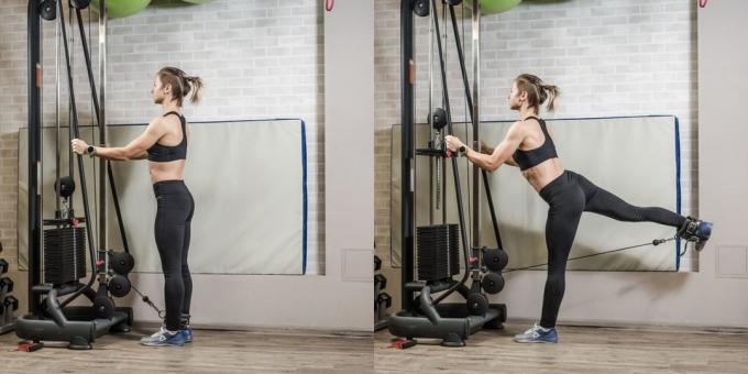 Le programme de formation pour les jeunes femmes dans la salle de gym: la jambe de plomb dans un crossover