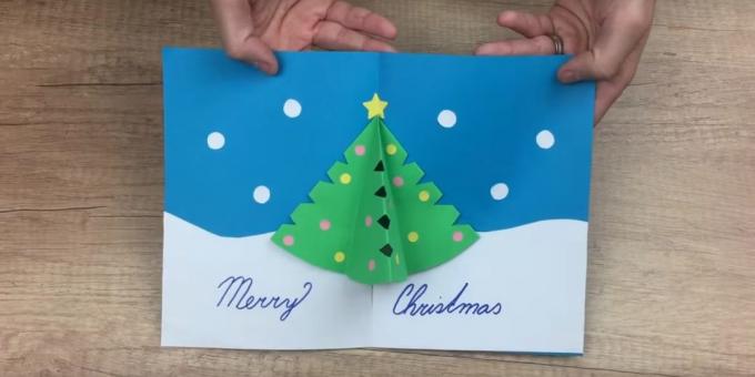 Carte de Noël avec vos propres mains avec l'arbre de Noël à l'intérieur du volumétrique